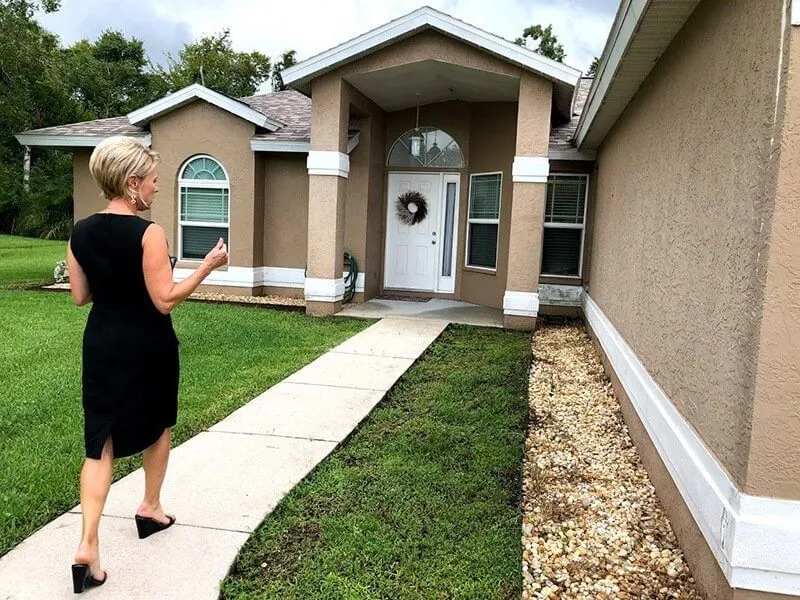 Lora Keller of RE Appraisals Appraising an Estate Home
